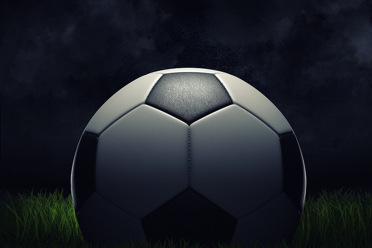 3D Football on Dark Background