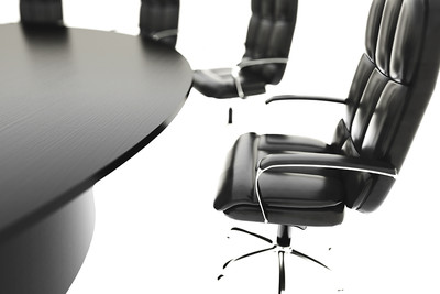 Black Boardroom Table Against a White Background