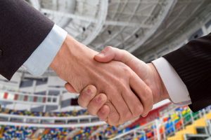 Business Handshake at Sports Stadium