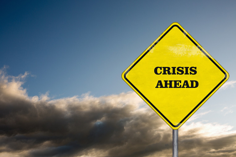 Crisis Ahead Road Sign