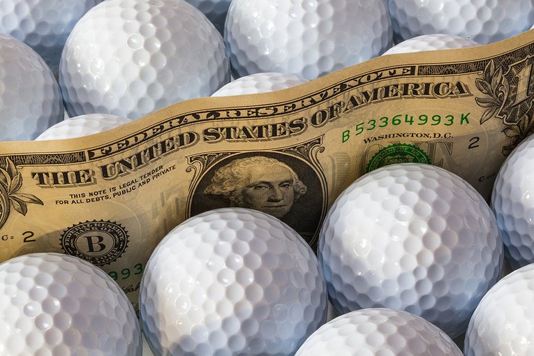 Dollar Bill Amongst Golf Balls