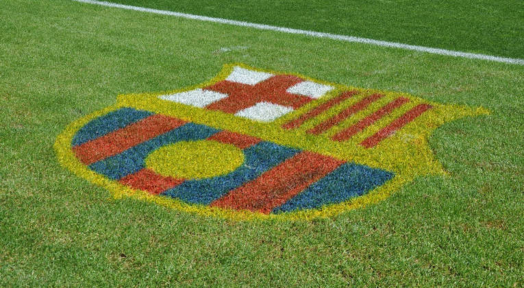 FC Barcelona Logo on Football Pitch