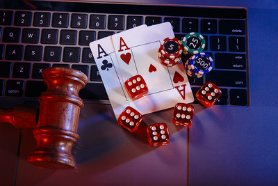 Gavel and Casino Chips on Laptop