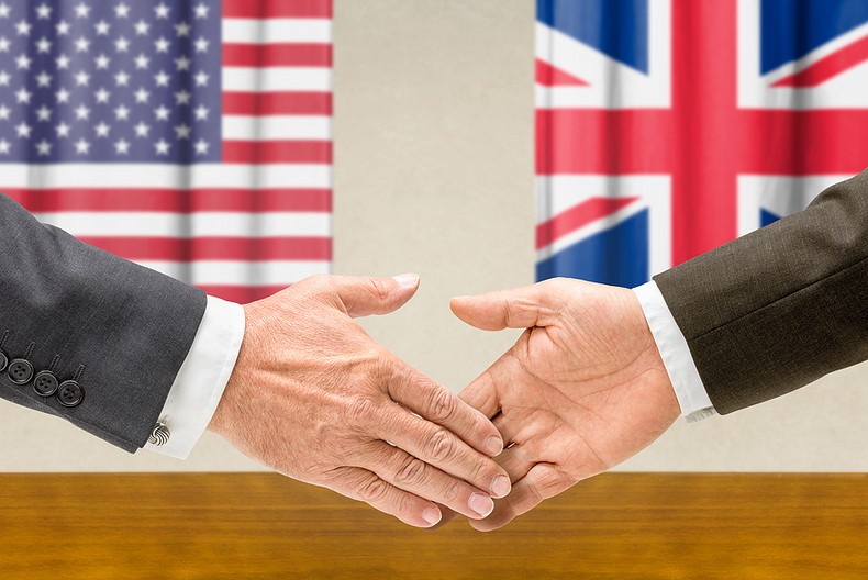 Handshake with USA and UK Flags