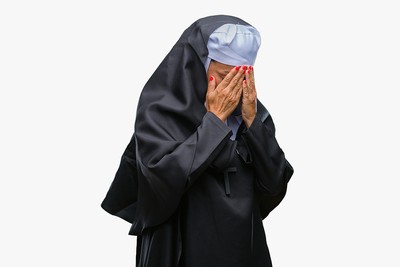 Nun Covering Face