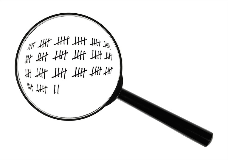 Tally Marks Under Magnifying Glass