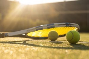 Tennis Racquet on Grass with Low Sun